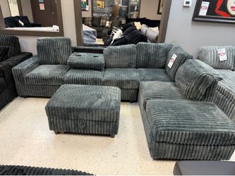 Gray sectional and storage ottoman