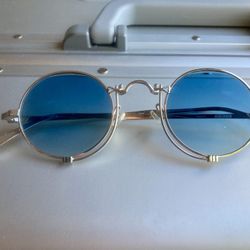 Matsuda titanium sunglasses with custom Zeeis blue shaded photochromic lenses that gets darker sun