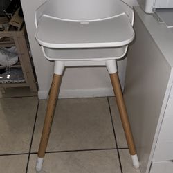 White And Wood Eating Baby Seat