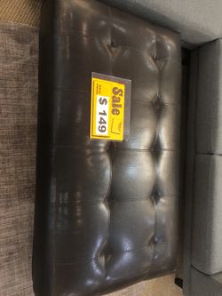 Black leather ottoman
