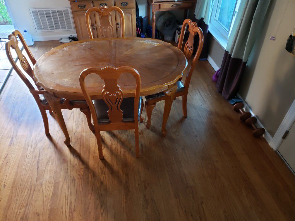 Real wood kitchen table and 5 chairs. In excellent condition. Table perfect size for apatment or home. Moving and must sell.