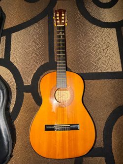 The Prelude Model TC-24 is a 3/4-size classical acoustic guitar made in Taiwan by V.M.I