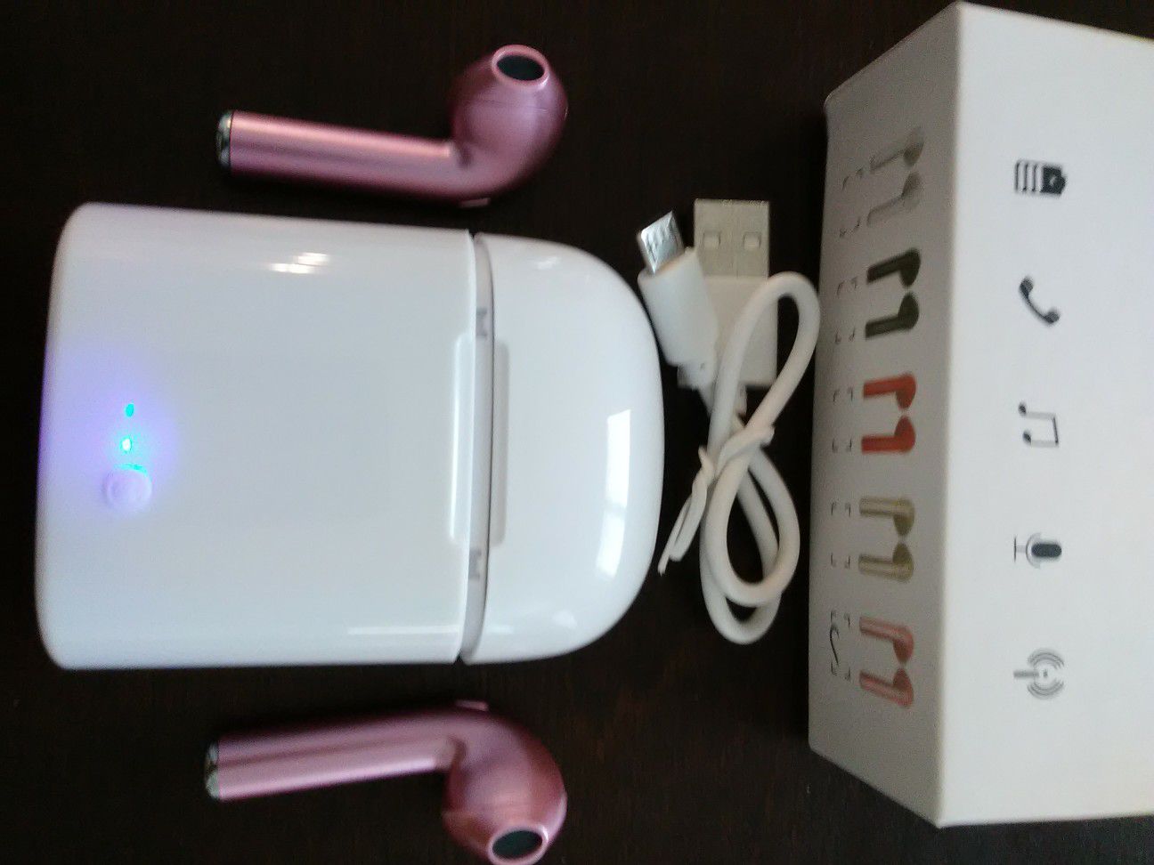 Brand new pink wireless Bluetooth headphones earbuds with wireless charger box included. These are not airpods