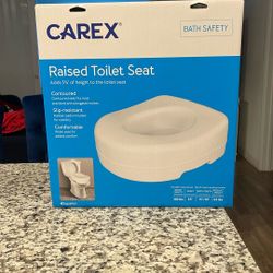 Raised toilet seat