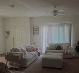 White/cream couches set with storage ottomans