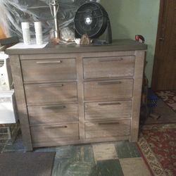 Like New Dresser.  Gray Tone.  47 Long. 40 Height.  Has 8 Drawo.