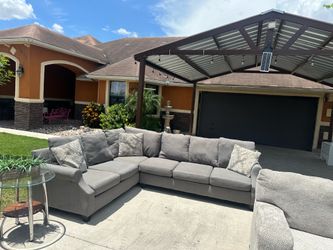 Beautiful grey sectional with pillows super comfortable and nice asking 550