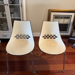 Two Calligaris Jam Sled base dining chairs, made in Italy