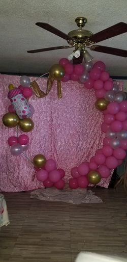 It's a girl backdrop and ballon arch