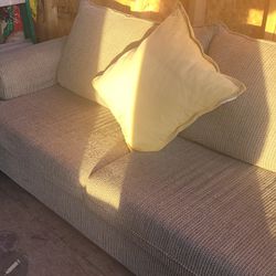 Light Brown Couch With Yellow And White Cahir With Light Brown Ottoman 