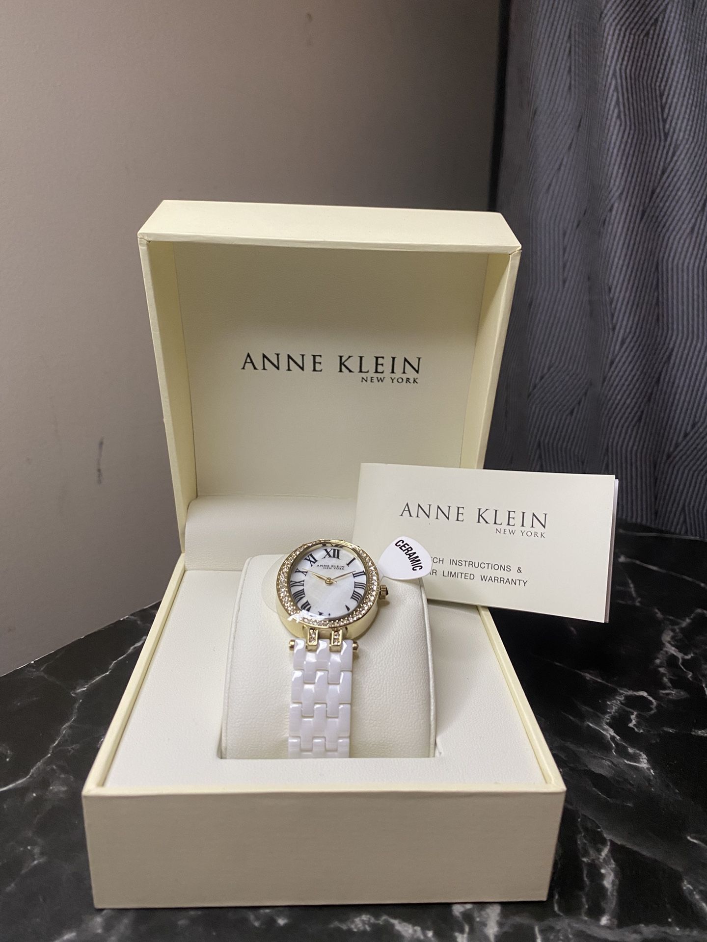 Anne Klein Women’s White Ceramic Watch with Gold-Tone Case & Crystal Accents
