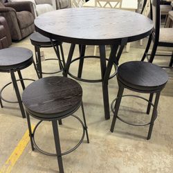 42 Inch Round counter height table with four swivel stools