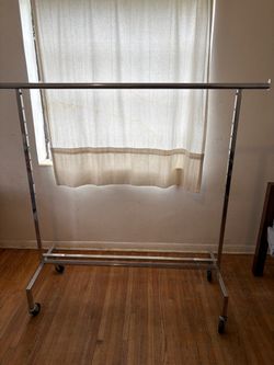 Chrome Rolling Clothes Rack with Bottom Shelf