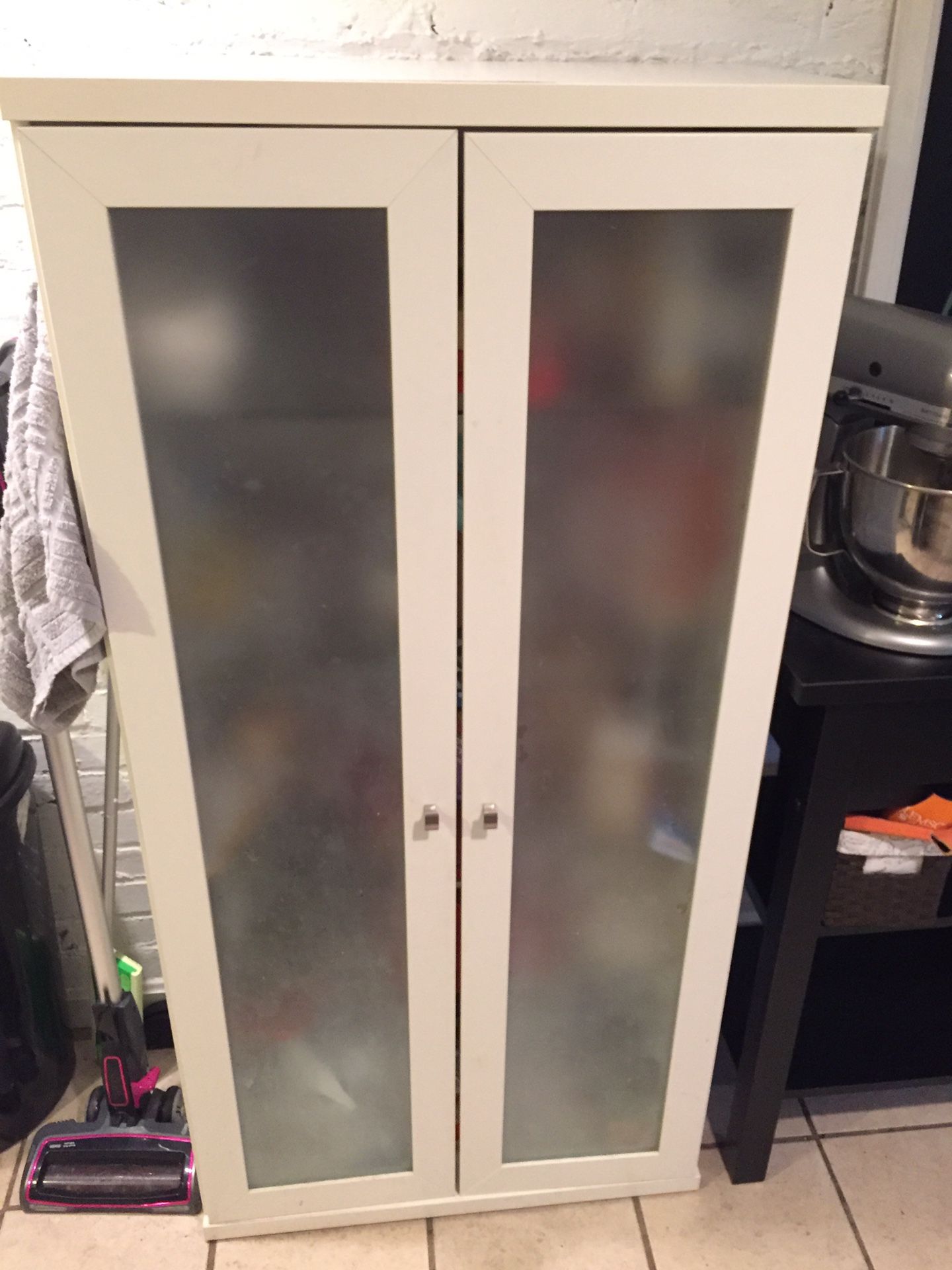 IKEA glass-door cabinet with shelving