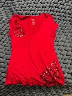 Bright red V-neck tee with sequin floral accents