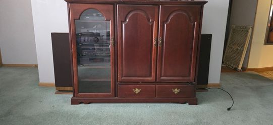 Entertainment center that holds t v stereo or whatever else