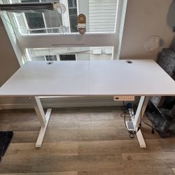 55” Adjustable standing desk and large boucle chair