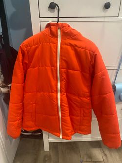 Orange or light red puffer jacket