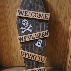 Coffin-Shaped Wooden Sign – “Welcome, We’ve Been Dying to Meet You”