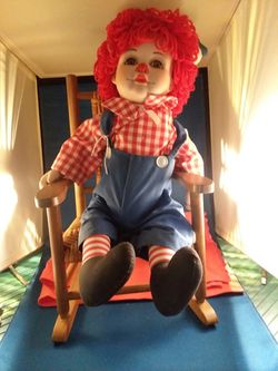 Raggedy Andy on chair