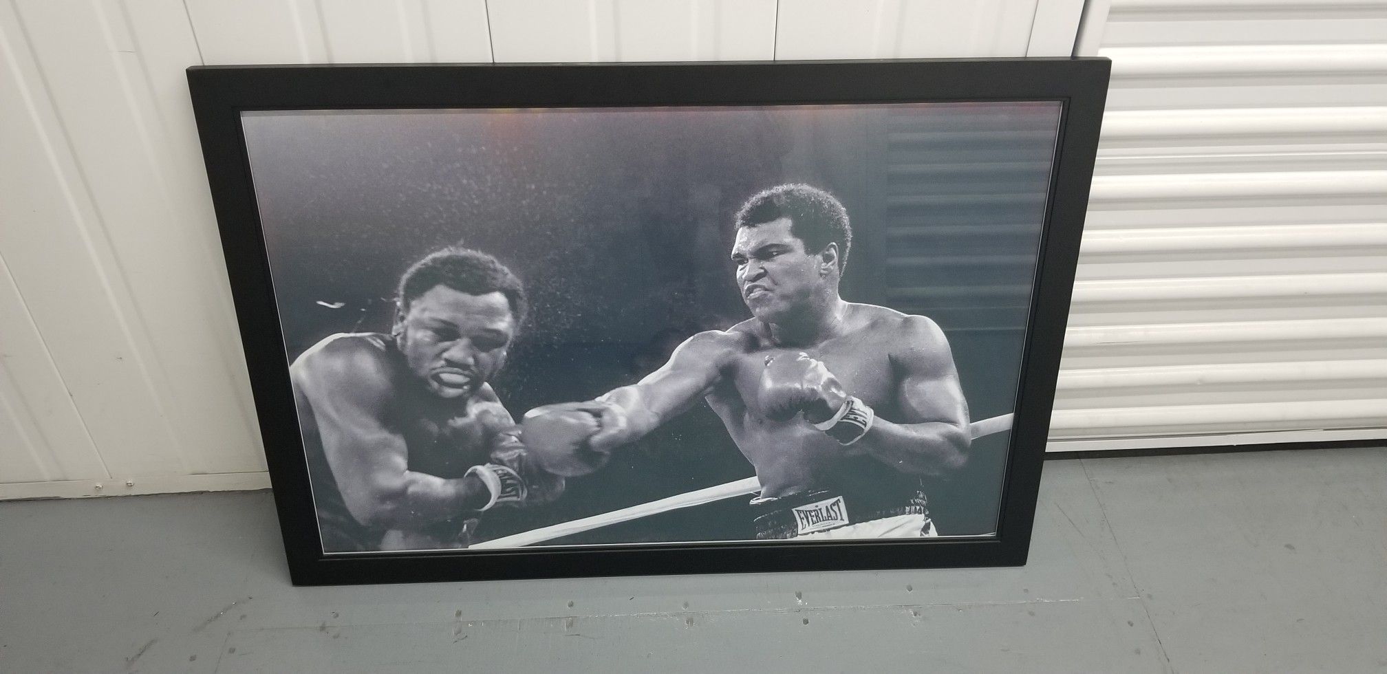 Ali-Fazier framed poster