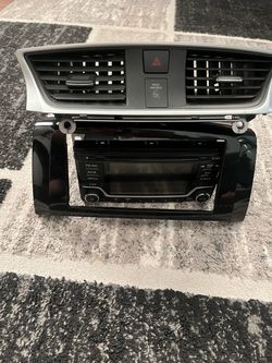 Nissan OEM Radio Head Unit with Dash Trim