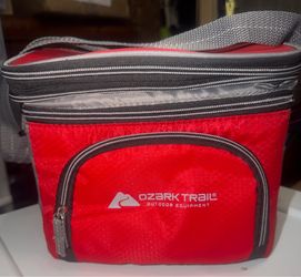 Preowned in great condition . The Ozark Trail 6 Can Cooler with 3 Pocket Soft Shell in Red is a versatile and portable cooler perfect for outdoor acti