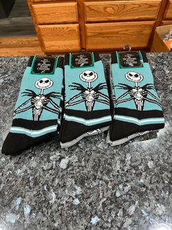 Disney Nightmare Before Christmas, Mens Crew Socks.  Lot of 3 pairs.  Size 6.5-12.  Brand new never removed from packaging .  Smoke free home