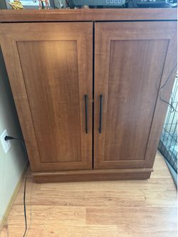 Two (2) Oak cabinets $150 each