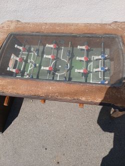 Vintage foosball table with glass top