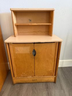 Small wooden cabinet shelf. Great for daycare or classroom storage