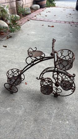 Antique rod, iron tricycle plant stand