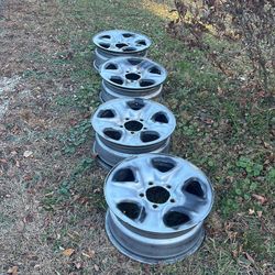 Four 18 x 8 Toyota five lug steel wheels
