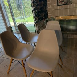 4 Modern white like new chairs 