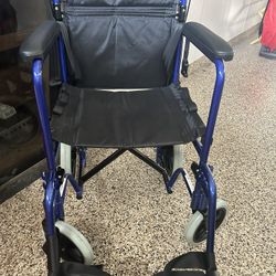 Blue Wheelchair And Exercise Bike