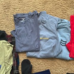 12+ Shirts. Tees And Flannels Along With 2 Pairs Of Athletic Shorts 