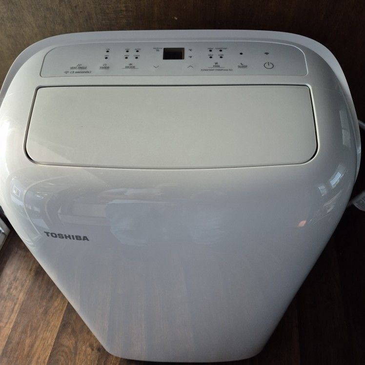 Toshiba 8,000 (DOE) BTU Portable Air Conditioner Cools 350 Sq. Ft. with Dehumidifier and Remote in White. 