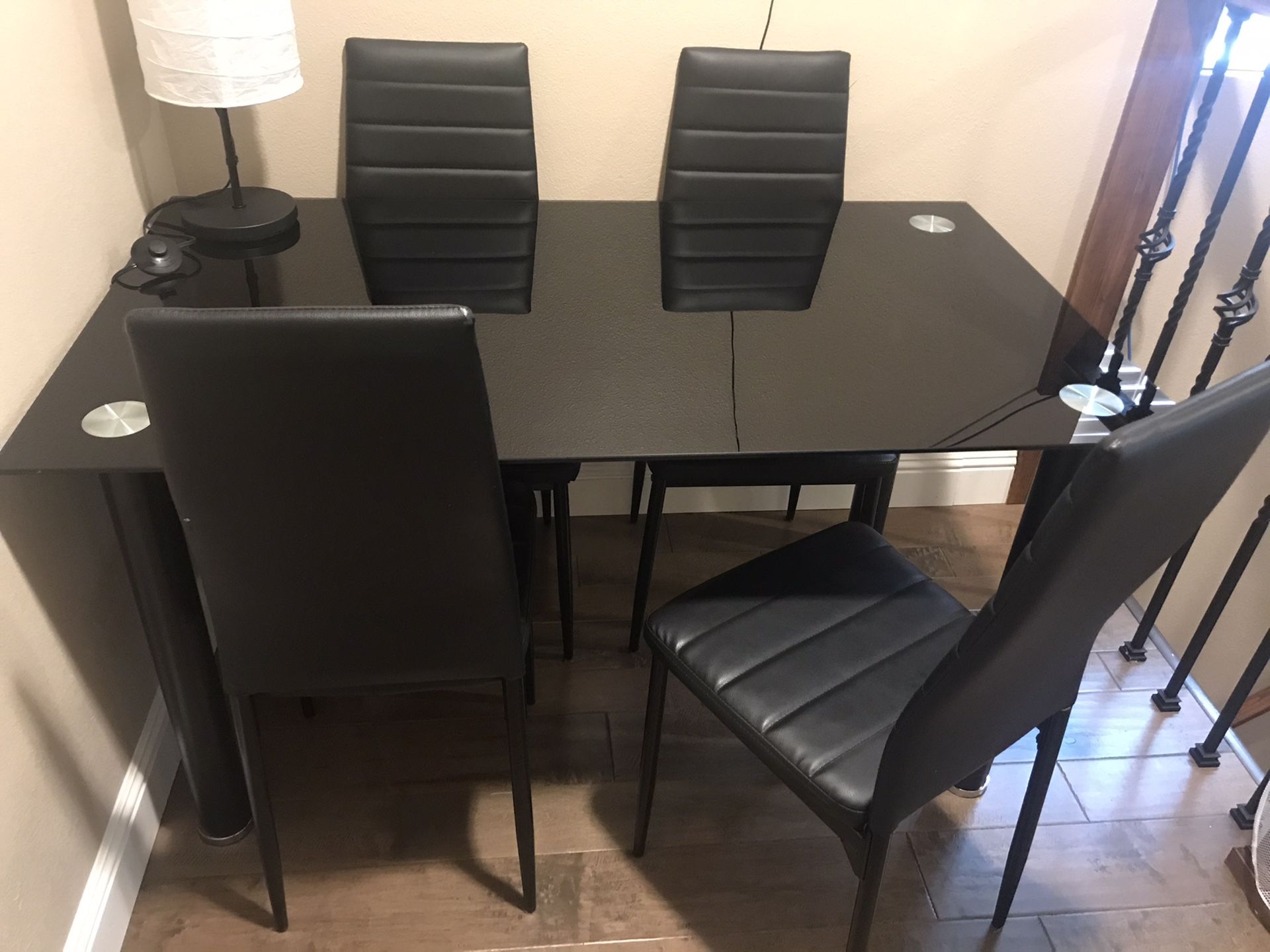 Black glass table and four chairs