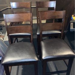 4 Pub Height Chairs And Hardwood Table With Leaves