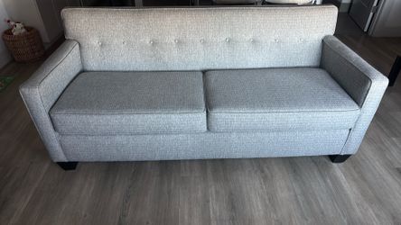 World market gray tufted sofa