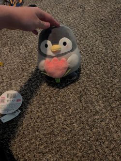 Kawaii penguin with a flower plush stuffed animal