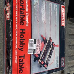 The product is a Craftsman Adjustable Clamping Portable Hobby Table. It's designed for use with portable power and hand tools, and includes several fe