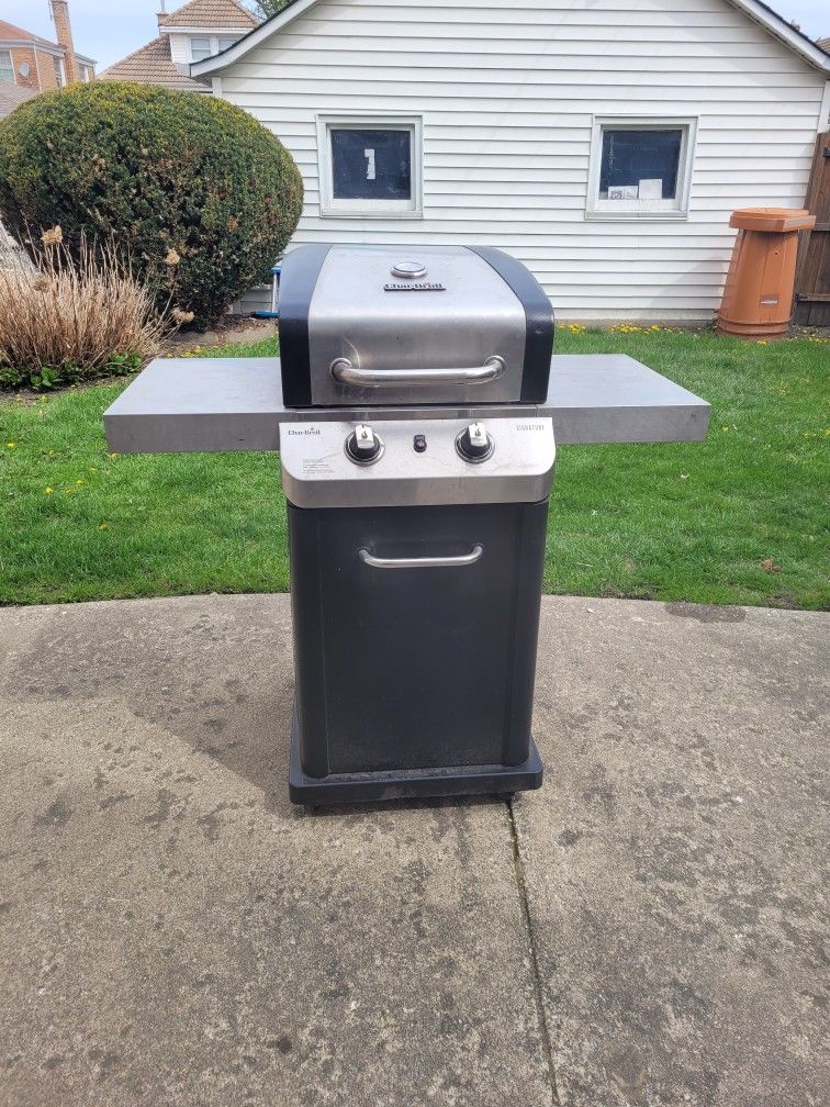 CHAR BROIL ,2 BURNER BBQ GRILL STAINLESS STEEL. IT INCLUDES ONE PROPANE TANK .$100.00 OR BEST OFFER. LOCAL PICK UP ONLY.
