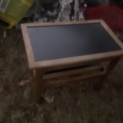 A Small Two Levels Table With 4 Wheels (19” Tall X 27” Long X 16” Wide (NO SHIPPING)