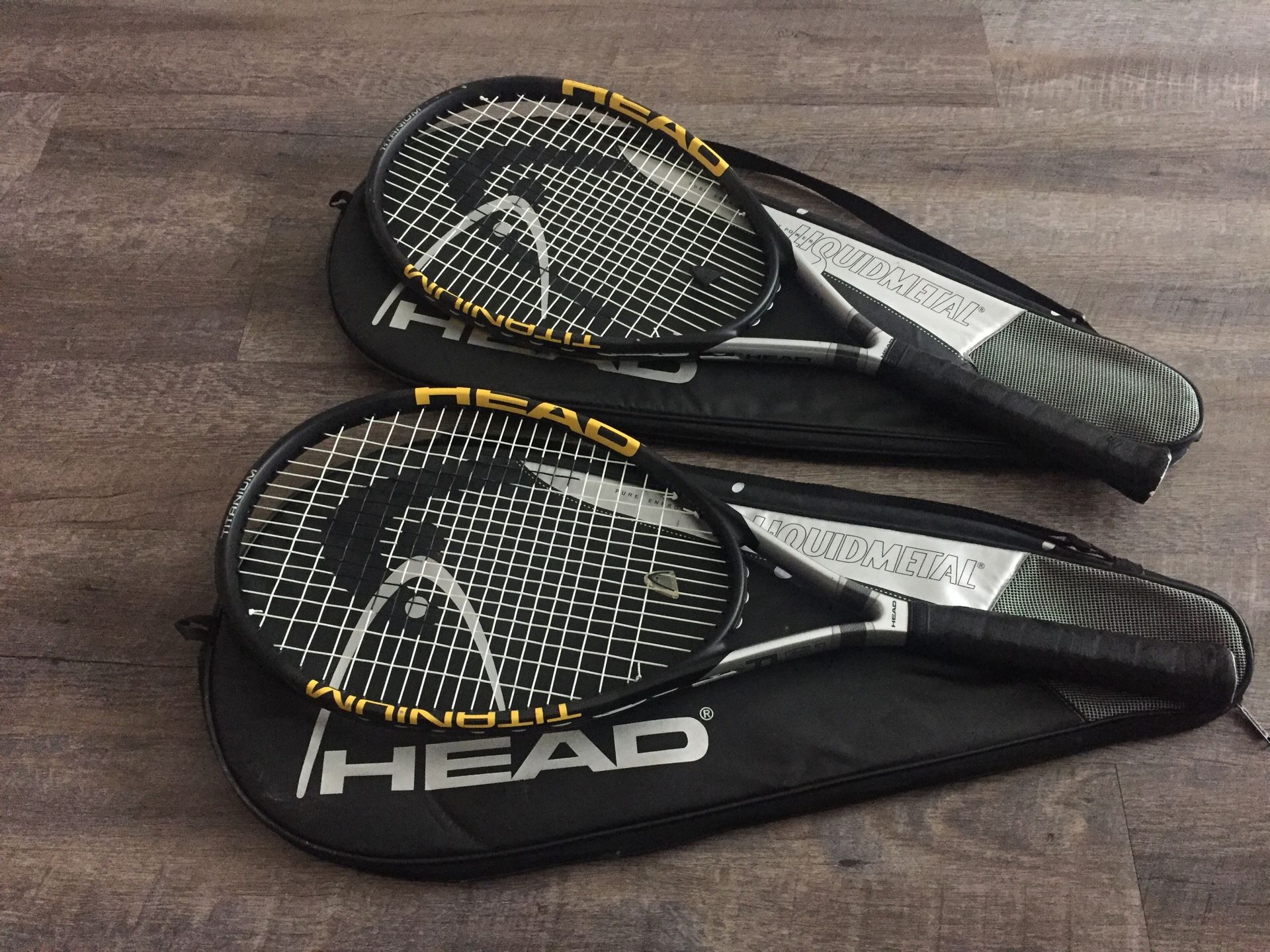 Two HEAD liquid metal tennis rackets