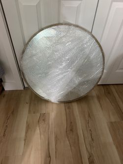 Gold round mirror