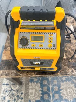 This is a CAT CJ1000DXT Portable Power Station with a 1200 Peak Amp Jump Starter, Air Compressor, and Power Inverter.