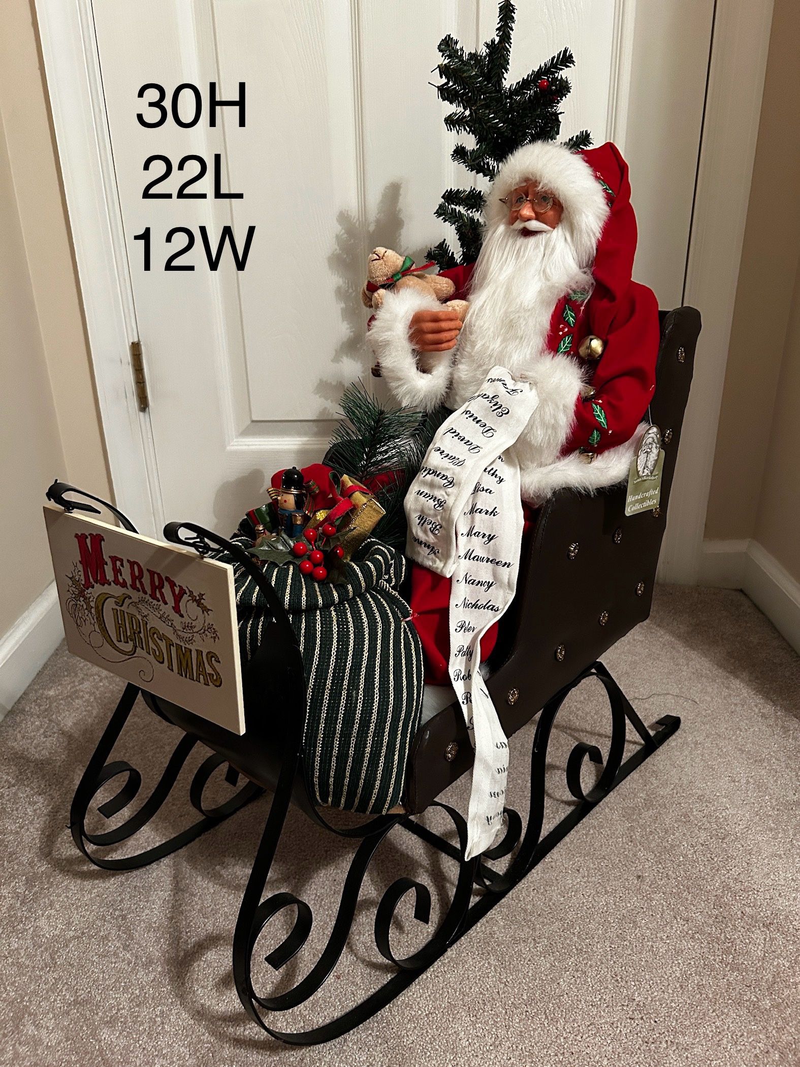 Handsome Santa with a bejeweled upholstered sled