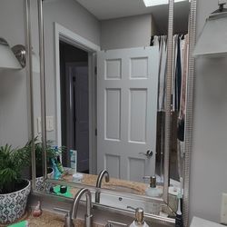 Single sink bathroom vanity cabinet and mirror