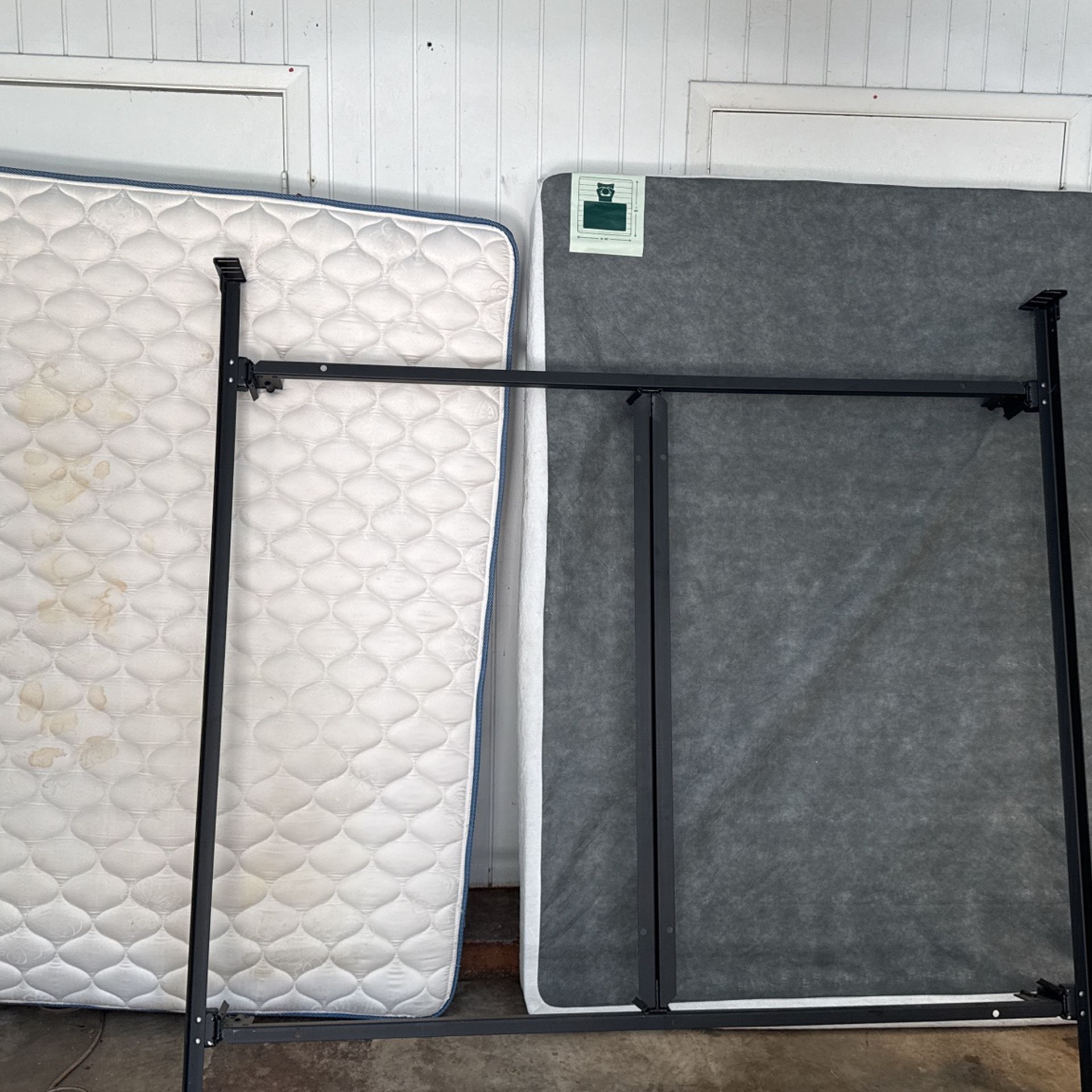 King bed, frame and metal box spring with cover.